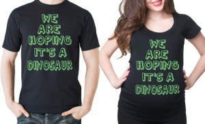 both partner's shirts: "We are hoping it's a dinosaur"