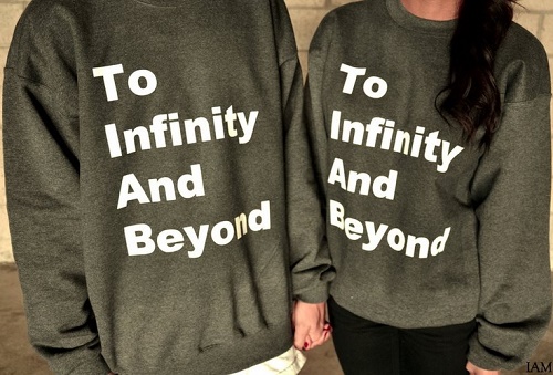 matching sweaters say "to infinity and beyond"
