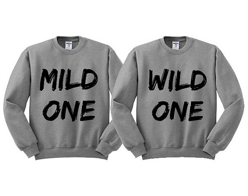 Matching sweaters say "mild one" and "wild one"