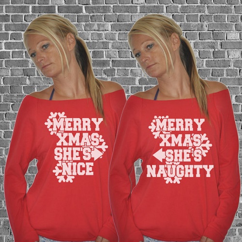 Matching sweaters. "Merry Xmax, she's nice" points to other sweater that says "merry Xmas she's naughty"