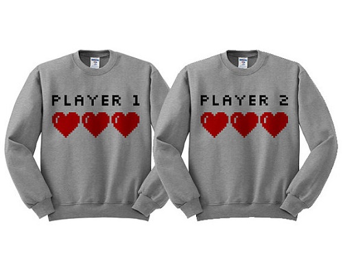 Matching sweaters say "player 1" and "player 2"
