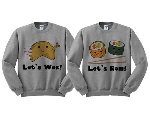 matching sweaters: "let's wok" with picture of fortune cookie, and "let's roll" with picture of two sushi rolls