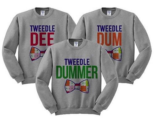 Matching sweaters say "tweetle dee," "tweetle dum," and "tweetle dummer"