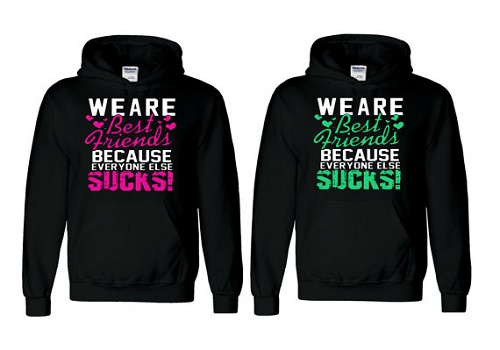 Matching sweaters say "We are best friends because everyone else sucks!"