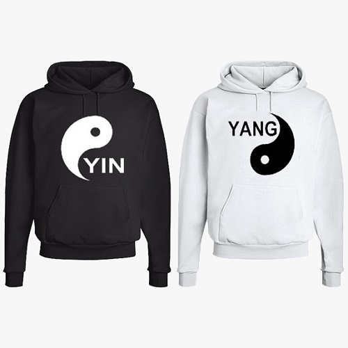 Matching sweaters one with Yin symbol, other with Yang symbol
