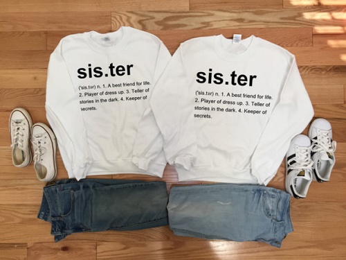 Sweater, dictionary parody. "sis.ter: (sis.ter) n. 1. A best friend for life. 2. Player of dress up. 3. Teller of stories in the dark. 4. Keeper of secrets."