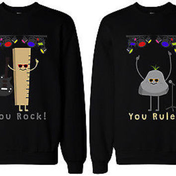 matching sweaters. "you rock!" with picture of ruler, and "you rule" with picture of rock