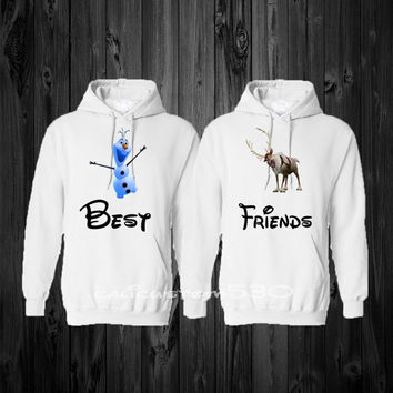 Matching Disney Frozen sweaters. One says "Best" with Olaf, the other says "Friends" with Sven