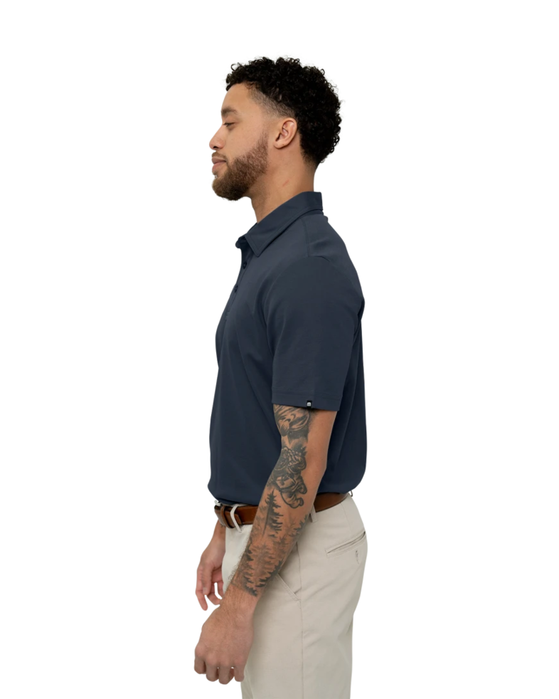 Image of a model wearing a TM1MU411 TravisMathew Oceanside Solid Polo
