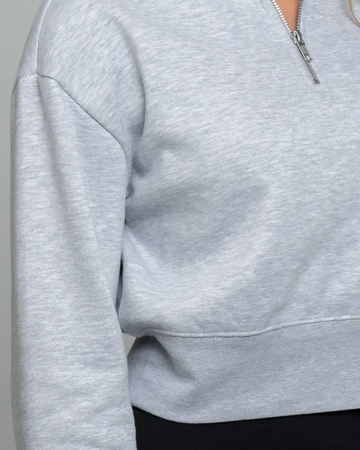 Closeup of a DT6111 District® Women’s V.I.T.™ Fleece 1/2-Zip