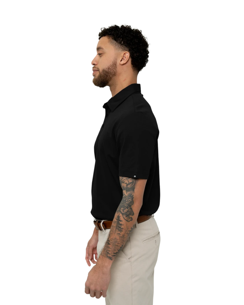 Image of a model wearing a TM1MU411 TravisMathew Oceanside Solid Polo