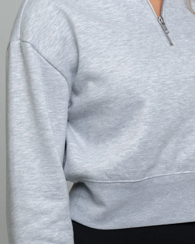 Closeup of a DT6111 District® Women’s V.I.T.™ Fleece 1/2-Zip