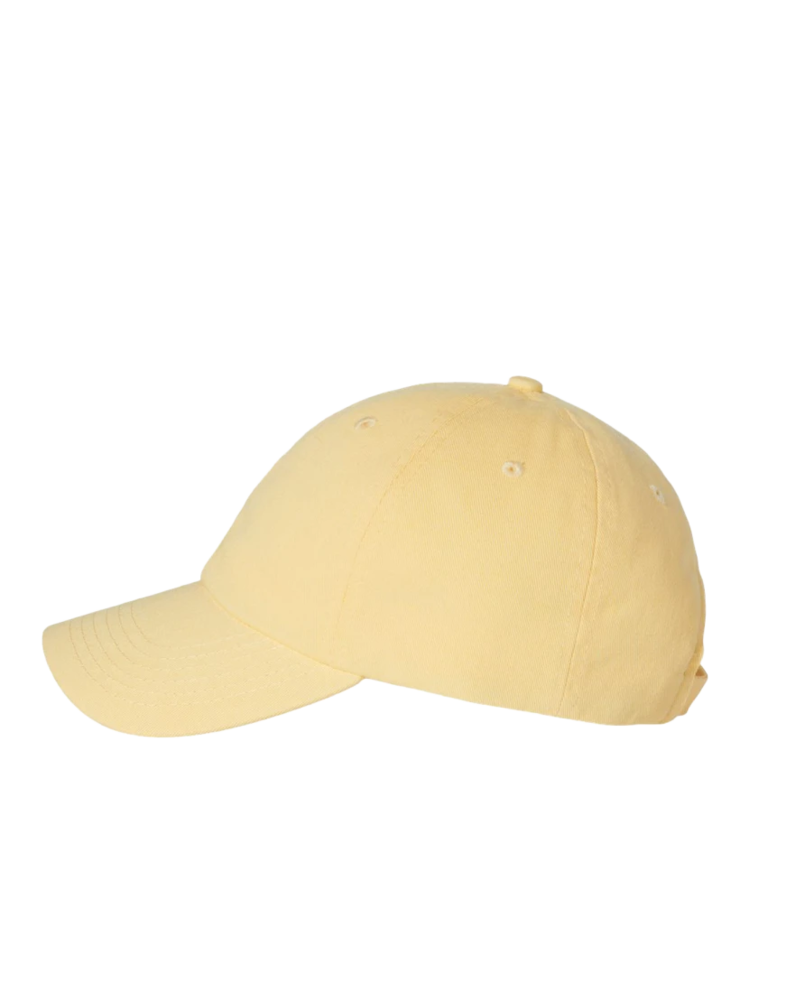 Image of a model wearing a VC300 Valucap Bio-Washed Cap