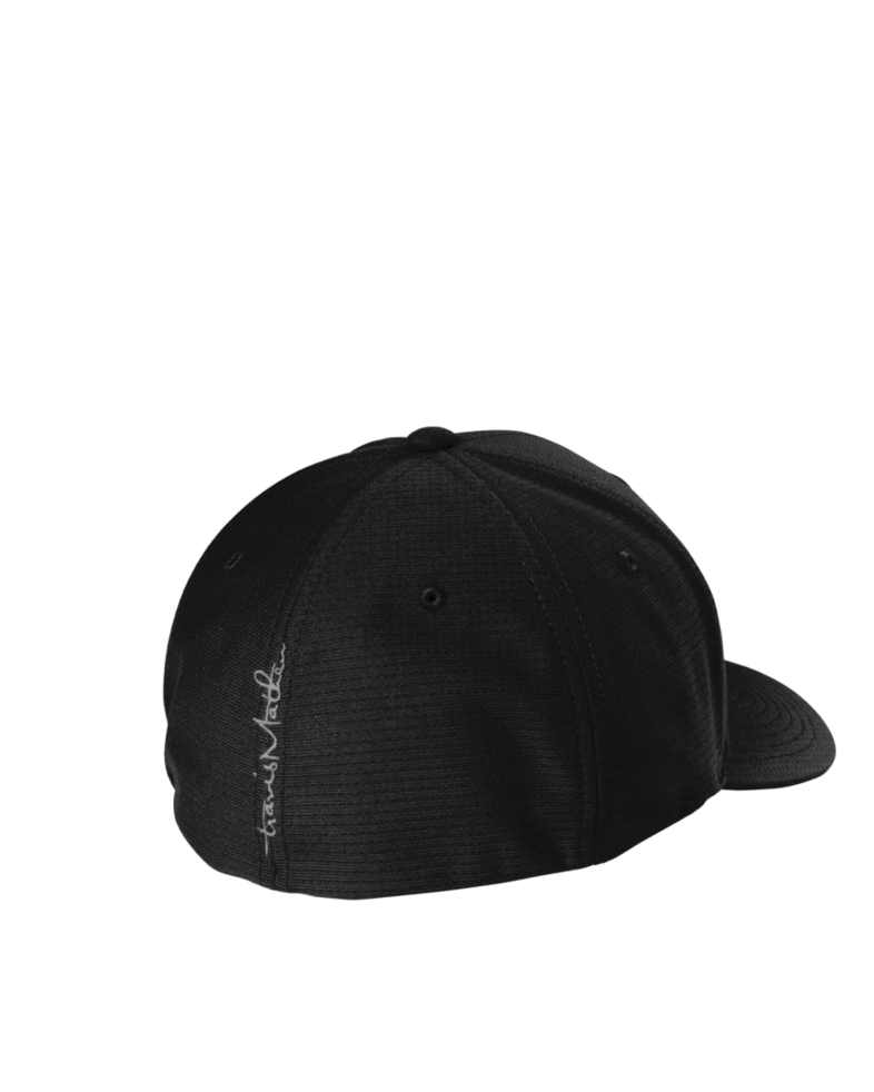 Image of a model wearing a TM1MU426 TravisMathew Rad Flexback Cap