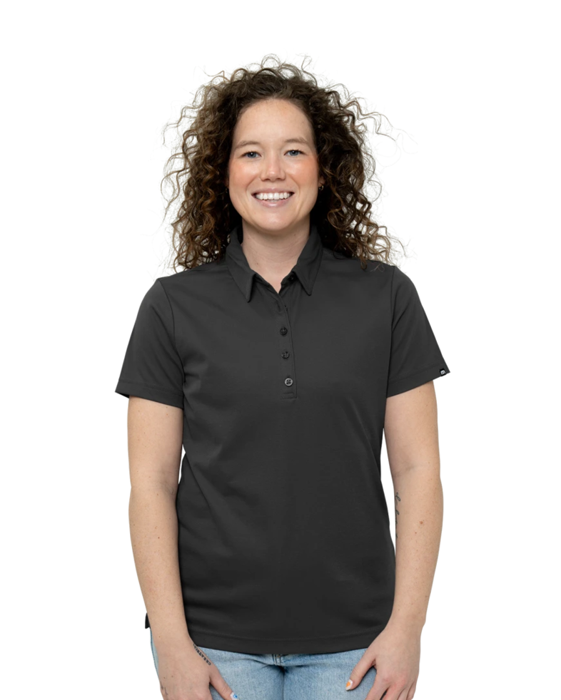 Image of a model wearing a TM1WW001 TravisMathew Ladies Oceanside Solid Polo