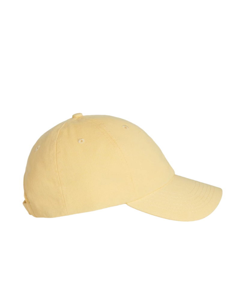 Image of a model wearing a VC300 Valucap Bio-Washed Cap
