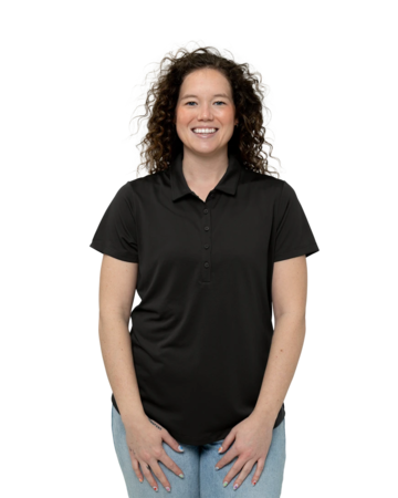 Model wearing a LK864 Port Authority® Ladies C-FREE™ Snag-Proof Polo