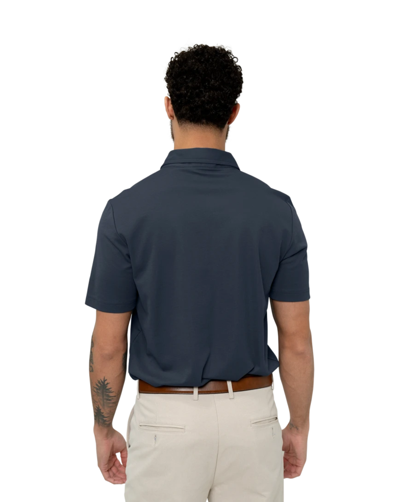 Image of a model wearing a TM1MU411 TravisMathew Oceanside Solid Polo