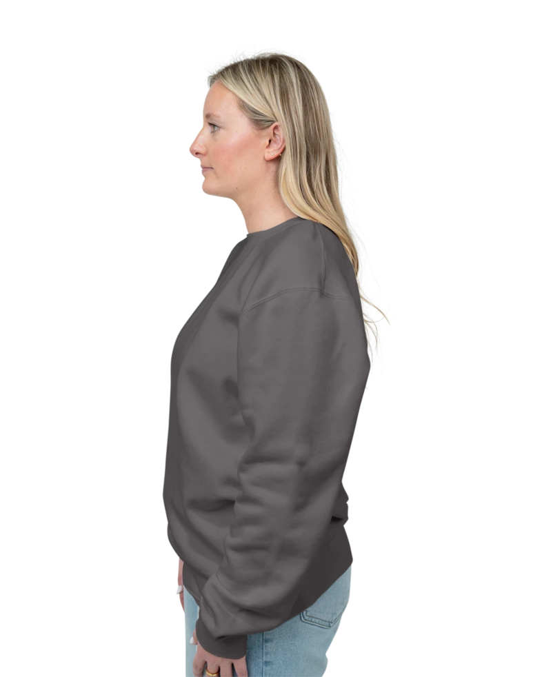 Image of a model wearing a PRM3500 Independent Trading Co. Unisex Midweight Pigment-Dyed Crewneck Sweatshirt
